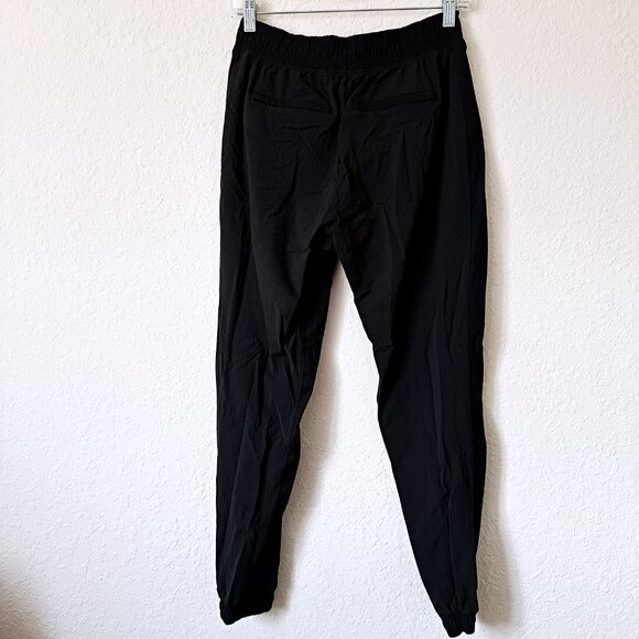 Athleta Trekkie Mid Rise Legacy Jogger 305514 in black Pants 2 - Picture 2 of 6